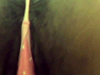 Ebony babe teases and strips in public bathroom