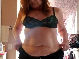 She applies lotion to her sexy skin