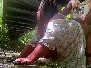 Under the public park bridge, a milf with big natural tits gets fucked by a big black cock outdoors.