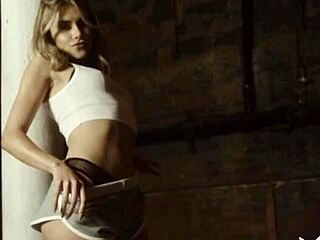 Beautiful blonde teen Amelia poses playfully with a ball, showing off her stunning figure.