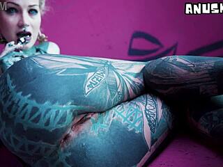 Tattoo girl stretches her asshole in solo anal play