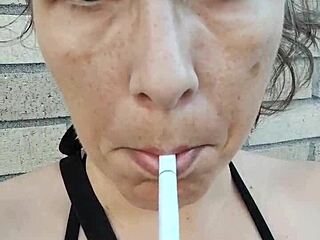 kelly kendricks lights up a cigarette outdoors, flaunting her big cleavage in the sun