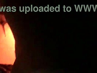 sexy tattooed curvy woman with piercings moaning softly in a relaxed setting