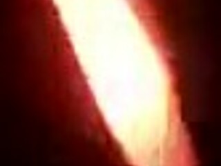 sexy tattooed curvy woman with piercings moaning softly in a relaxed setting