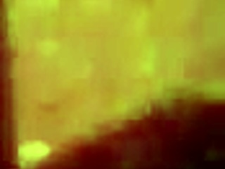 sexy tattooed curvy woman with piercings moaning softly in a relaxed setting