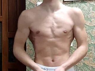 Skinny boy flexes his muscular body in underwear at home