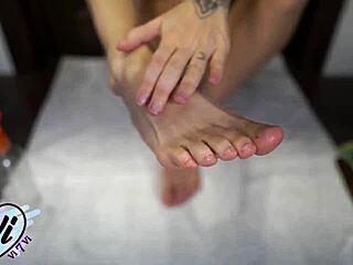 brunette shows oiled feet and legs closeup 😍