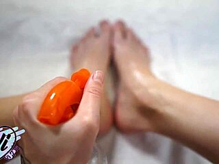 brunette shows oiled feet and legs closeup 😍