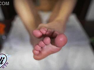 brunette shows oiled feet and legs closeup 😍