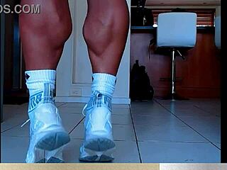 Muscular calves flex in bodybuilder legs showcase