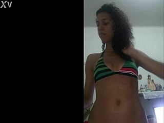 Pretty brunette teases with wet shaved pussy in red bikini