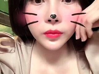 Asian girl shows off big tits in sexy live session