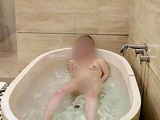 Hey, watch this cute Japanese college student bathing solo with her small tits and skinny body