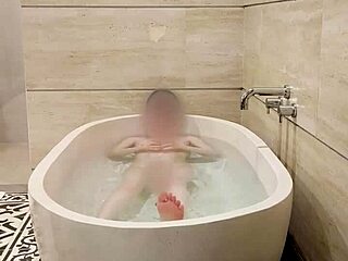 Hey, watch this cute Japanese college student bathing solo with her small tits and skinny body