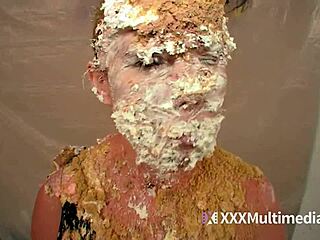 Two blondes get wet and messy while pieing each other in the face during a fun session