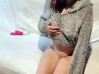 Hey, check this teen slut in fleece hitting an intense orgasm while masturbating with her toy