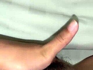 Inserting two fingers carefully inside during a personal moment with an Asian amateur in homemade style.