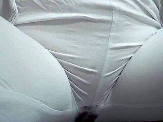 Close-Up View of Woman Urinating from Spread Pussy Lips in Detail