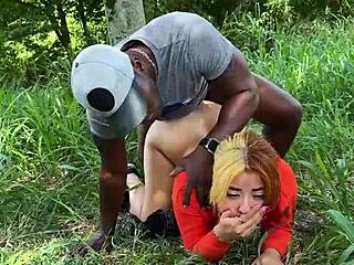 Horny Colombian flashes tits while black guy pounds her outdoors