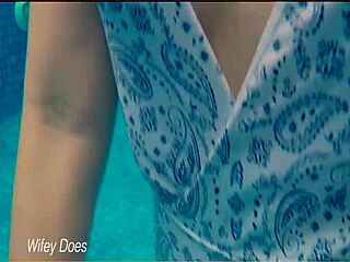 check out this hot milf wife flashing big tits at the hotel pool in her one-piece swimsuit.