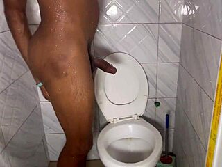 amateur dude strokes monster cock under shower spray in steamy bath