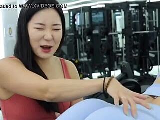 Two sexy Korean fitness models stretch yoga leggings tight gym bodies athletic workout