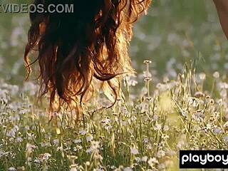 Petite Filipina Kit Rysha strips clothes outdoors posing nude in wildflower field skinny small tits