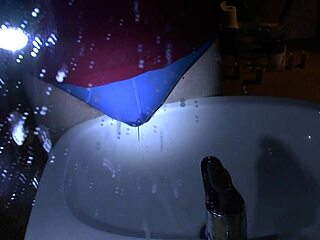 woman pees blue underpants directly over sink