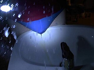 woman pees blue underpants directly over sink