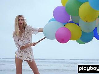Skinny Italian milf blonde from fancy Torino strips naked on the beach playing with balloons.