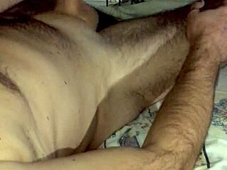 in the dark bedroom, mature hands stroke huge cock to explosive cum-swapping orgasm