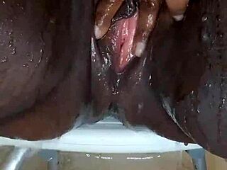 Black milf shaves wet pussy close-up before tattooed orgasm masturbation