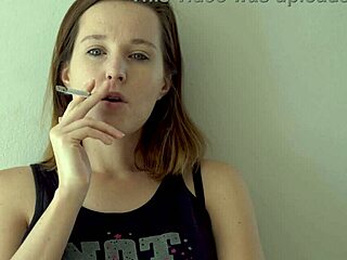 hot brunette lights up smokes and teases her curves slow