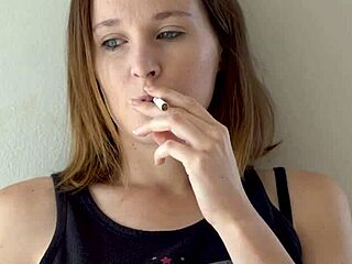 hot brunette lights up smokes and teases her curves slow