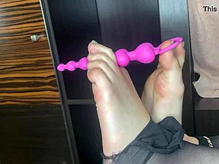 Classy Amateur In Black Stockings Gives Closeup Footjob To Anal Toy On Bed!