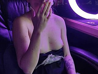 Elegant lady's seductive ritual with a glowing cigarette draws you closer