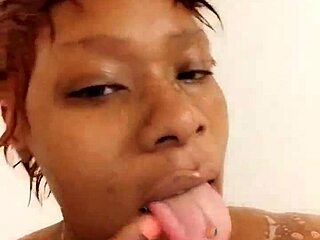 Danielle's voluptuous black curves glisten under shower streams in steamy bbw bath