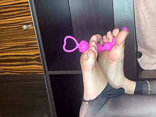 Classy Amateur In Black Stockings Gives Closeup Footjob To Anal Toy On Bed!