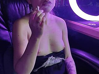 Elegant lady's seductive ritual with a glowing cigarette draws you closer