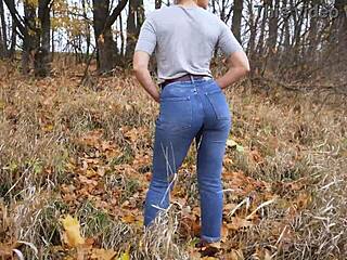 sexy milf in tight blue jeans bends over teasing huge ass outdoors during erotic massage