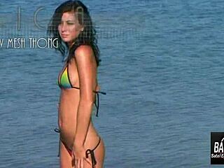 Jessica sways sensually in bikini teasing erotic beach moves