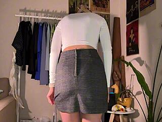 Cute brunette teen tries on skimpy skirts showing off big natural ass and tits