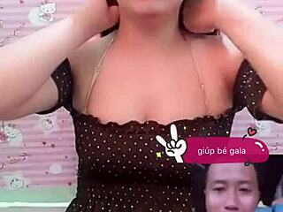 Red panties peek from asian skirt