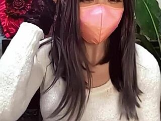 Watch! Masked beauty crossdresses as shemale jerks off on cam!