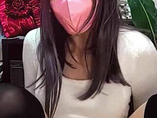 Watch! Masked beauty crossdresses as shemale jerks off on cam!