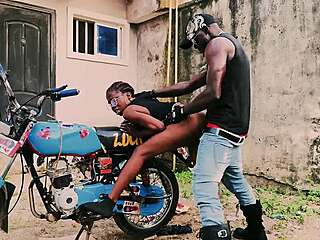 petite biker babe bends over bike. her man pounds her in public garage