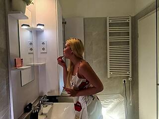 sexy blonde college girl strips satin nightie in bathroom teasing her curves