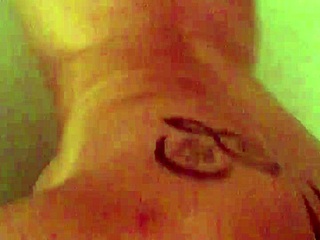 She teases her perky tits and round ass in steamy shower solo at 19