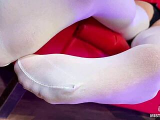 Goddess Flaunts Massive Booty and Long Legs in White Stockings Teasing on Red Couch