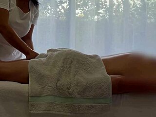oiled asian babe massages caucasian cock to huge jizz blast